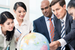 Business people looking at a globe